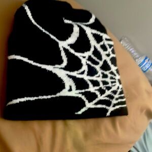 A black and white Spider-Man beanie